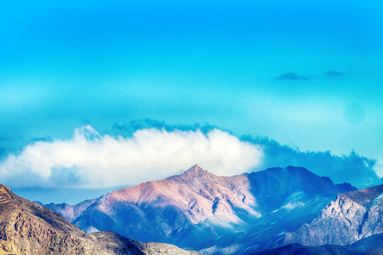 Zagros Mountains. Kuhrud range in the mountains of Central Iran in winter, Clouds are held back by a ridge