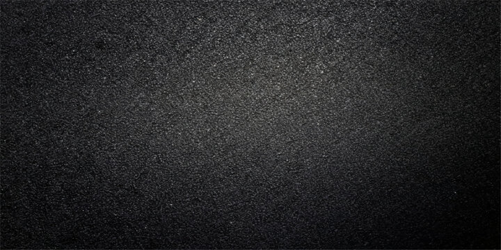 A dark, rough surface of black leather and bitumen creates a textured asphalt pattern with grey stone details, perfect for a macro material backdrop or wallpaper design