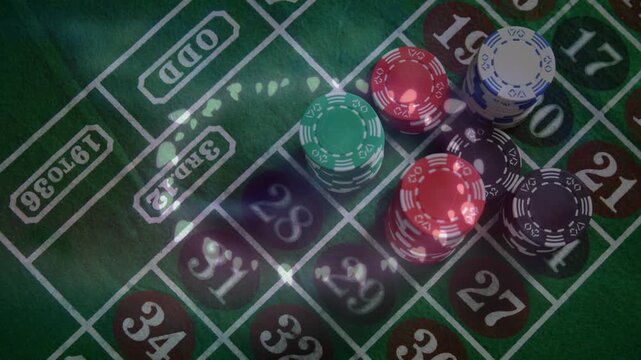 Animation of glowing fairy lights over close up of a stack of casino poker chips on a table