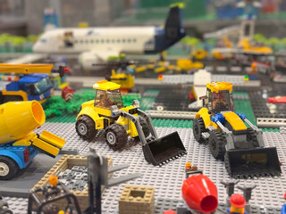 Obraz premium Lego construction site with yellow tractors