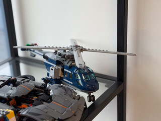 Obraz premium Blue lego helicopter model on glass shelf