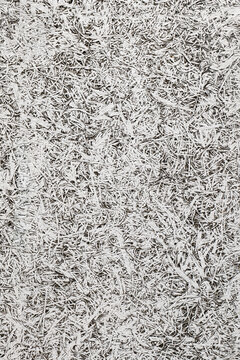 断熱や吸音性に優れた建築資材である木毛セメント板の複雑な繊維構造テクスチャ,