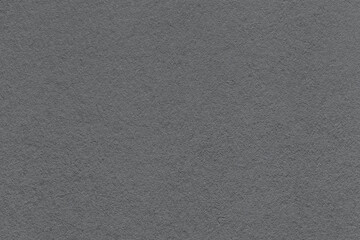 Fototapeta premium Dark gray textured paper background with subtle grain surface and soft structure. Graphite backdrop, macro