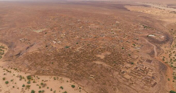 High-altitude Aerial View Of Expansive Desert Settlement Of Ouadane In Mauritania.