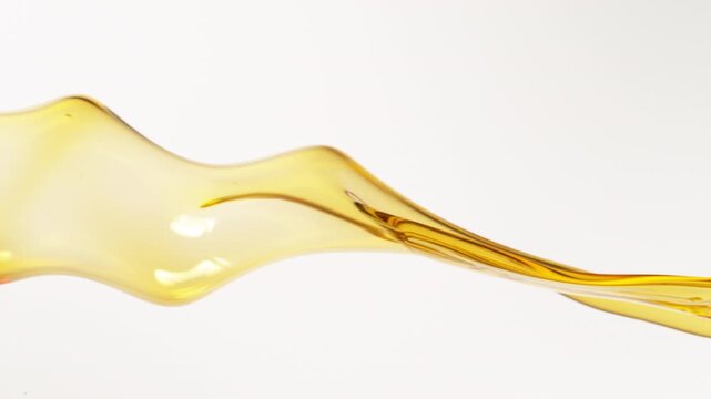 Super Slow Motion Shot of Pouring Oil . Filmed on High Speed Cinematic Camera at 1000 FPS