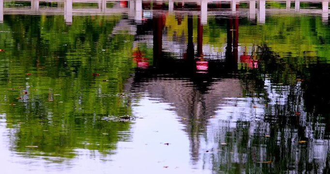 Abstract reflections of Jiangnan architecture in shimmering water