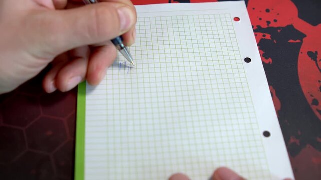 Creative hands sketch and write on lined paper, showcasing artistic process. A notebook sits on a textured surface with a vibrant design.