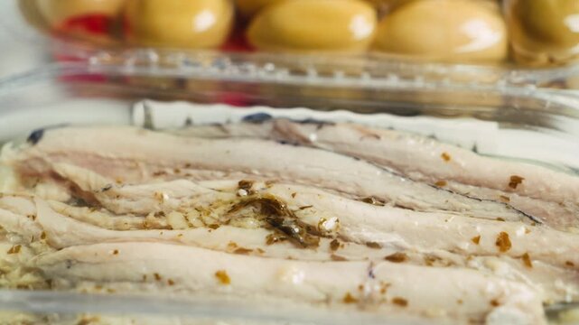 Traditional Catalan snacks for wine, beer and vermouth include green olives and anchovies. High quality 4k footage