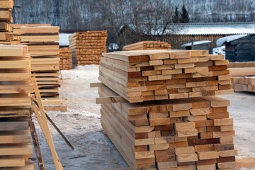 A sawmill with boards and other lumber lying on the site. © Marina