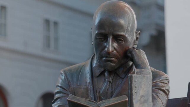 Neoclassical architecture of Palazzo Modello in Piazza Unita d Italia in Trieste Italy with ornate facade and stone statues under a clear blue sky sunny day