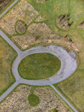 Aerial view of geometric patterns etched into the landscape, creating a tapestry of textures and tones, De Kiem, Flevoland, Netherlands.