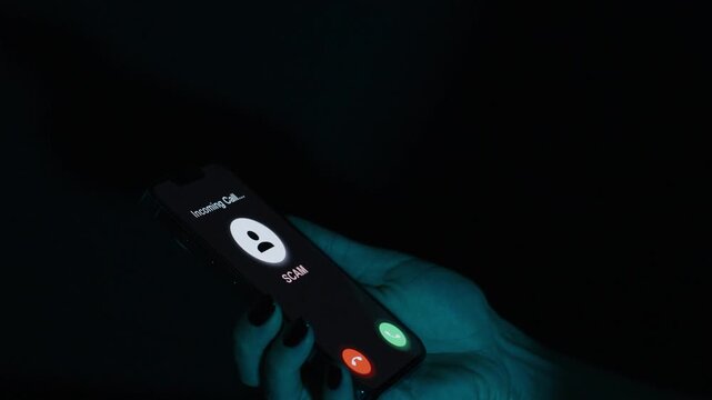 The screen displays "SCAM" as the user declines the call, preventing a potential scam interaction.