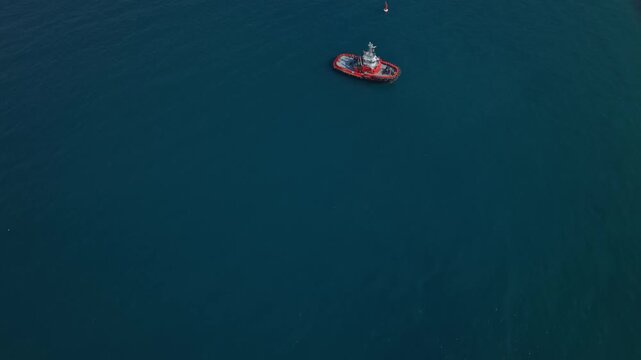 Aerial view of a tugboat in Santa Marta port, calm sea atmosphere