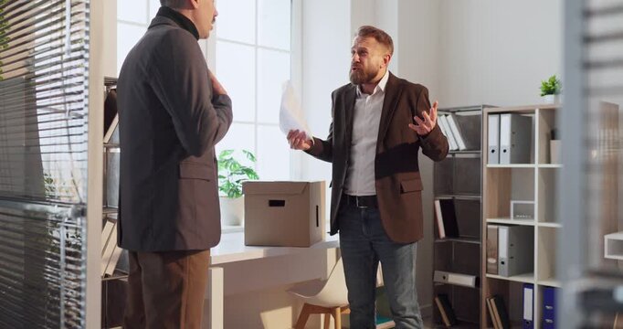 Manager confronts employee over report in office. An irritated boss gestures with papers while addressing a worried subordinate near desk and shelves. Workplace conflict and accountability theme.