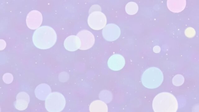 Soft pastel bokeh background with various sized light purple, blue, and pink circles on a light purple surface with subtle sparkle effect.