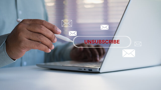 Business professional using stylus on laptop to click unsubscribe button interface, digital marketing opt out concept, email subscription cancellation, user control privacy choice, Unsubscribe click