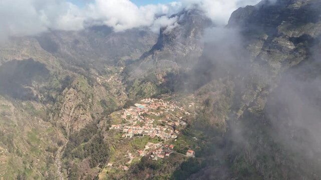 Portugal, Madeira, Curral das Freiras, Nuns Valley. Deep within the rugged interior of Madeira, this secluded village sits at the base of a massive natural cauldron shielded by towering peaks. 