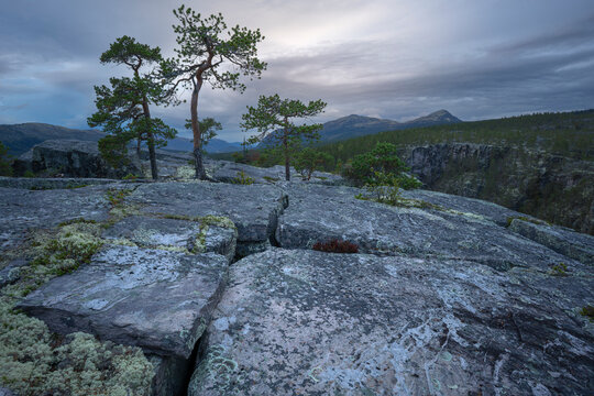 Cloudy sky view seen from rocky hill top
