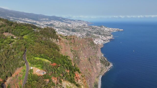 Portugal, Madeira, C&acirc;mara de Lobos, Cabo Gir&atilde;o. This expansive aerial view captures one of Europe's highest sea cliffs as it drops vertically into the deep blue Atlantic. 