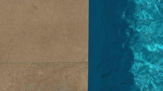 Bright Azure Pool Edges Shine. Reflective Ripples Dance On Sparkling Blue Pool Surface