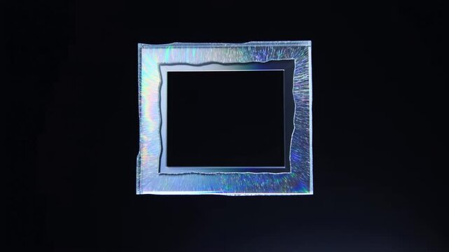 Time lapse static centered view of square glass frame crystallizing into iridescent textured border on dark isolated studio background