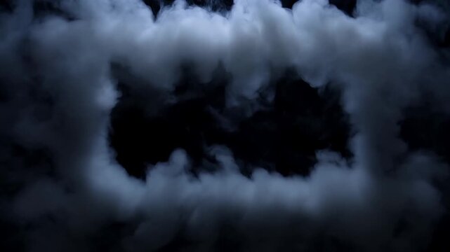 Slow motion view of smoke forming rectangular frame in dark studio, clouds drifting and swirling around black backdrop with subtle stationary camera