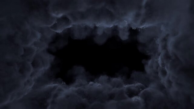 Slow motion static zoom of swirling smoke and particles forming expanding void and vortex around dark center inside cloud tunnel setting