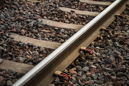View of railway track over stone pile