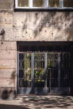 Remains of Warsaw Uprising during WW2 - bullet holes on building on Emili Plater Street, Poland