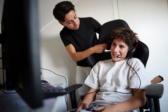 Boys spending leisure time playing video games
