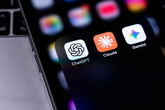 Claude by Anthropic, ChatGPT by OpenAI, Gemini by Google mobile icons app on a screen smartphone iPhone. Claude, ChatGPT, Gemini are leading AI-powered chatbots. Batumi, Georgia - February 19, 2026