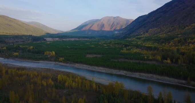 North Fork Flathead River valley with autumn forest and mountains outside Glacier National Park near Polebridge, aerial drone