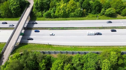 Germany autobahn traffic moving under pedestrian bridge
