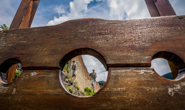 Stocks and impalement scene in front of Poenari ruined castle, home of Vlad the Impaler on Cetatea Mountain, Romania