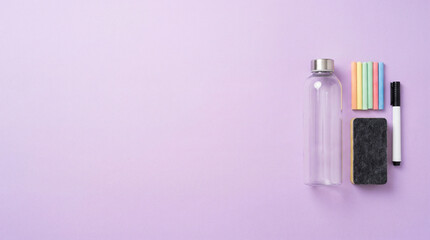 Fototapeta premium Minimalist workspace essentials on purple background for youtube end screen