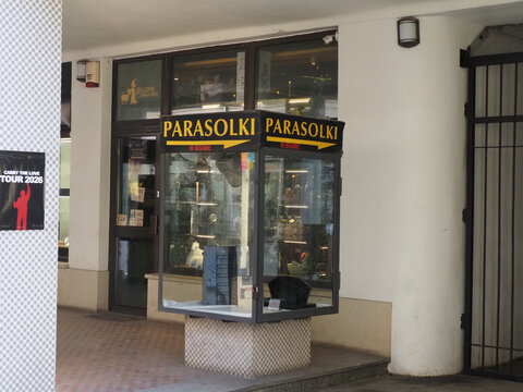 Small umbrella workshop shop window with Polish sign Parasolki meaning Umbrellas in Warsaw center