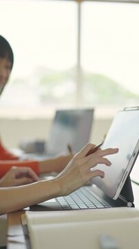 Collaborative digital learning session modern office space video content bright environment close-up view interactive engagement