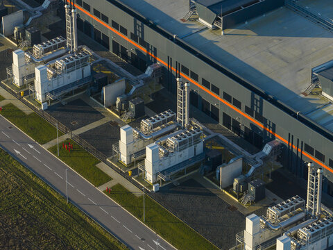 Aerial view of ai data center facility, showing server infrastructure, cooling, and network technology for global connectivity, Middenmeer, Netherlands.