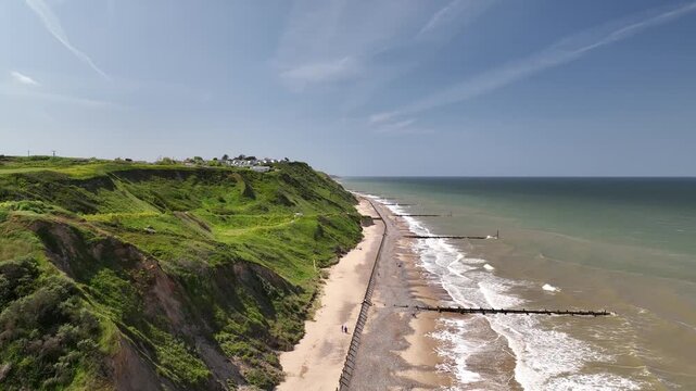 Epic High Altitude Drone Panorama of Mundesley Green Cliffs and Coastline Stretching to Horizon