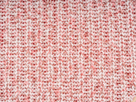 Rosa-wei&szlig;es Strickmuster als textile Hintergrundstruktur
