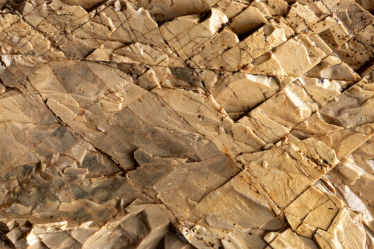 A piece of cracked flintstone as a background texture.