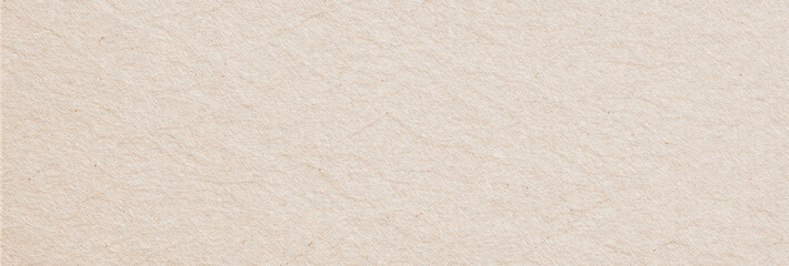 Obraz premium Beige recycled paper displaying a textured surface with slight creases and visible fiber details