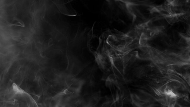 Detail Shot of Atmospheric Smoke Slowly Floating on Black Background