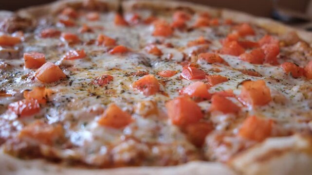 Perfectly baked margherita pizza features vibrant tomato sauce, creamy mozzarella slices, Herbes de Provence  and spices.