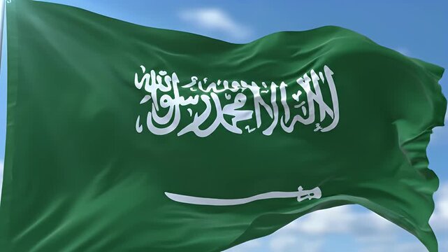A green flag with white Arabic script and a sword flutters against a blue sky