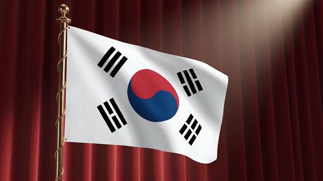 A white flag with a red and blue circle and black trigrams waves