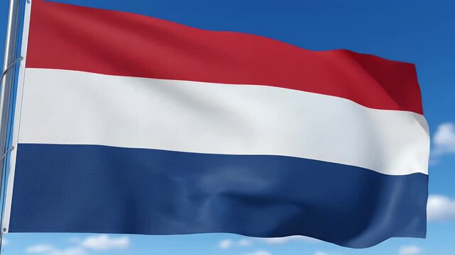 A vibrant red, white, and blue horizontal striped flag waves gently against a clear blue sky