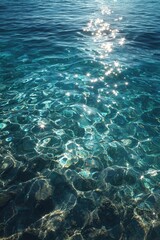 Obraz premium Crystal-clear water shimmers with sunlight