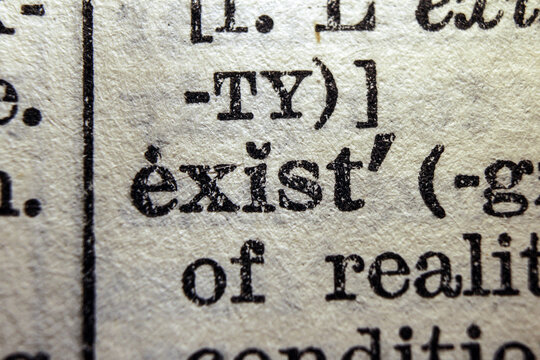 Word exist printed on dictionary page, macro close up