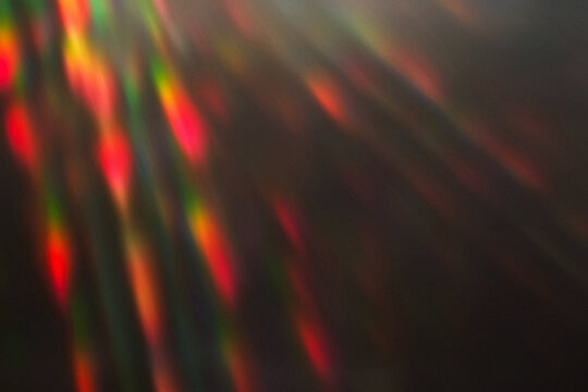 Sun Light Leak Rays with Color Dispersion and Chromatic Distortion Background Overlay. Subtle grain, noise and dust texture. Atmospheric overlay background for web design, digital art, banners, etc